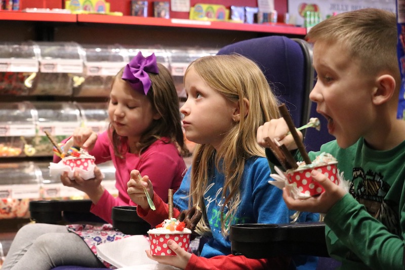 Kids eating ice cream in the Movie Theatre Seats at Abigail’s Candy Shop in Clovis